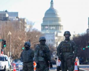 Police and National Guard soldiers near the US Capitol Building in Washington. Photo: Getty Images 