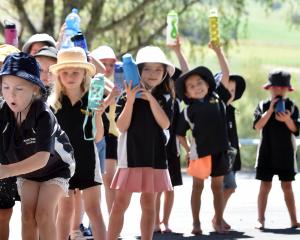 Waikouaiti School pupil Bonnie Goodman (6) fills up her drink bottle with water provided by the...