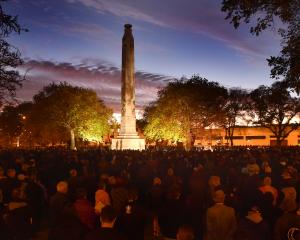 Dawn breaks over the cenotaph at Queens Gardens as thousands of people marked Anzac Day in...