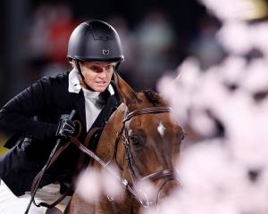 Jonelle Price riding Grovine De Reve finished highest of the Kiwi trio in 11th place. Photo: Reuters