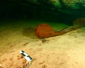 A wooden canoe used by the ancient Maya and believed to be over a thousand years old. Photo:...