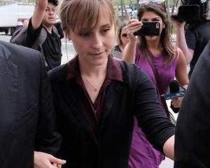 Actor Allison Mack, known for her role in the TV series Smallville, leaves the United States...