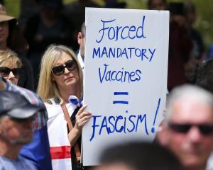 A protester in Wellington makes her feelings known about compulsory Covid vaccinations. PHOTO:...