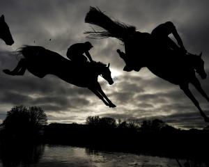 Runners clear the water jump at Wincanton Racecourse in England. PHOTO: GETTY IMAGES