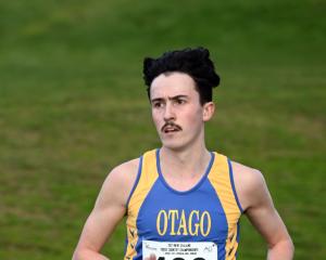 Oli Chignell strides to victory in the New Zealand cross-country championships at Chisholm Links...