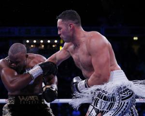 Joseph Parker lands a blow on Derek Chisora during their bout in Manchester. Photo: Reuters