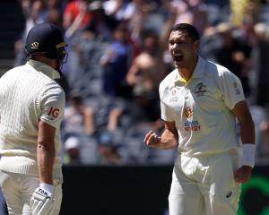 Australia's Scott Boland celebrates taking the wicket of England's Jonny Bairstow. Photo: Reuters