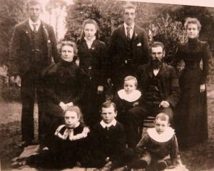 Margaret Hood (seated) with husband John and their eight children in this family photo taken...