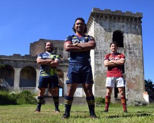 Highlanders players (from left) Liam Coltman, Folau Fakatava and Marty Banks don the new...