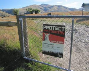 A sign asking people to report wallaby sightings is posted at the entrance to Oteake Conservation...