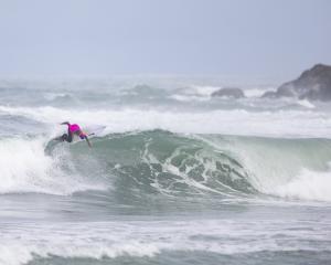 Christchurch surfer Ava Henderson rides a wave during the New Zealand surfing championships near...