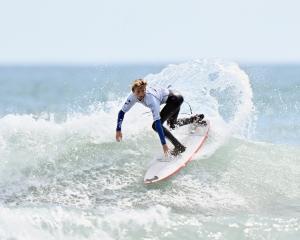 Dunedin surfer Lewis Murphy competes in the under-18 boys final during the final day of the New...