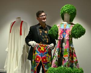 Otago Museum exhibitions and creative services head Craig Scott admires the Miss South America...