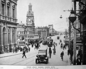 Pedestrians, cyclists, horse-drawn transport, trams and cars share Princes St in 1922. PHOTO:...