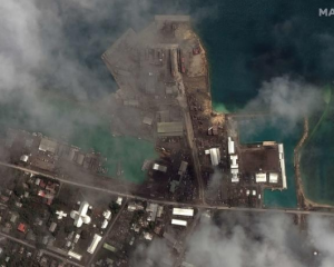Volcanic ash covering the port at Nuku'alofa on 18 January Photo: Handout / Satellite image ©2022...