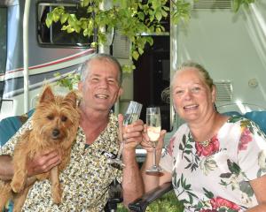 Mike and Diana Reece, of Masterton, with their Australian terrier Roxy at the Wingatui Racecourse...