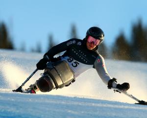 Aaron Ewen competes in the sitting downhill race at the world para snow sports championships in...