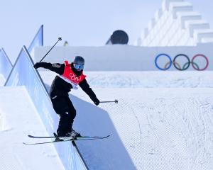 Finn Bilous performs a trick during the men’s freeski slopestyle qualification event yesterday at...