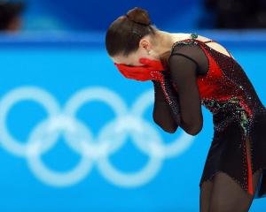 Kamila Valieva of the Russian Olympic Committee reacts after her performance. Photo: Reuters