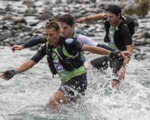 Simone Maier tackles a river crossing during the Coast to Coast on Saturday. PHOTO: IAIN MCGREGOR