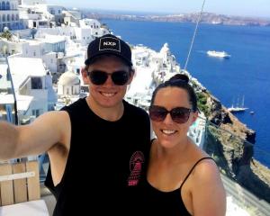 Tom Latham on the iconic Greek island, Santorini, with wife Nicole. Photo: Supplied