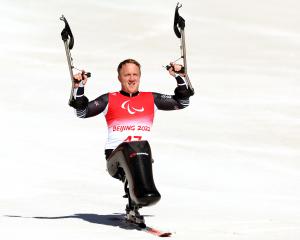 Corey Peters celebrates his gold medal winning run. Photo: Getty Images