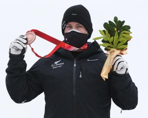 Wanaka-based para skiier Adam Hall poses with his bronze medal following the Para Alpine Skiing...