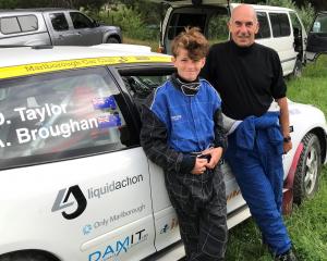 Grandson-grandfather duo Arthur Broughan (13) and David Taylor (67) take a break from Otago Rally...