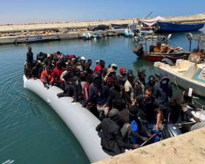 Migrants rescued by the Libyan coastguard in the Mediterranean Sea arrive in Garaboli, Libya,...