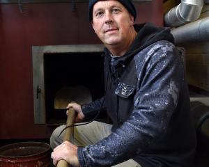 Caretaker Alister Wilden sits beside the broken boiler at Carisbrook School  yesterday. PHOTO:...