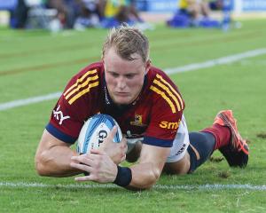 Sam Gilbert, of the Highlanders, scores a try during his team’s round 11 Super Rugby Pacific...