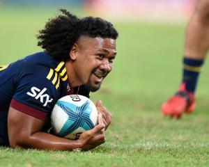 Folau Fakatava scores for the Highlanders against the Reds in Brisbane on Friday night. PHOTO:...