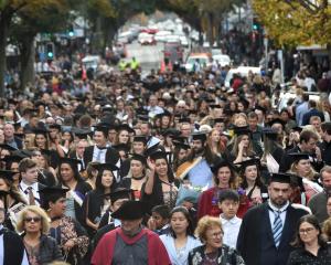 The University of Otago graduation parade makes it  way down George St in Dunedin on Saturday. It...