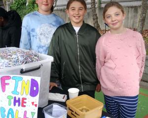 Game masters (from left) Giuliana Cochrane, Lillian Henderson and Daisy Baker tend their stall at...