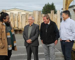 Hokonui Runanga senior cultural adviser Matu Coleman-Clarke (left) welcomes (from left) Otago...