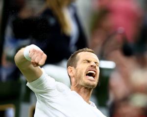 Sir Andy Murray celebrates winning his first round match against James Duckworth. Photo: Reuters 
