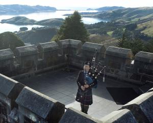 Sally Craik plays on the Larnach Castle tower along with other pipers throughout the Commonwealth...
