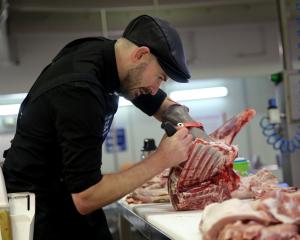 Butcher Isaac Webster, of Dunedin, practises his plan to add value to meat ahead of competing in...