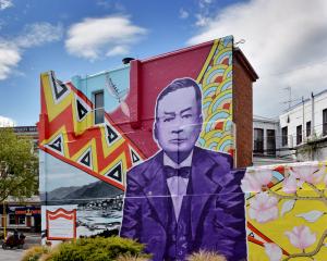 The Crown Hotel, tucked in close at the foot of City Rise. The mural was painted on its Broadway...