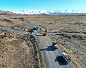 Contractors at work on the Lake Ohau Rd bridge. PHOTO: SUPPLIED/SOUTHROADS