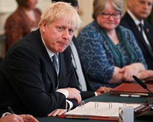 Boris Johnson at a Cabinet meeting on Tuesday. The resignations come after months of scandals and...
