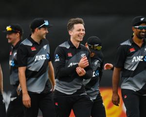 Michael Bracewell (c) celebrates with teammates after the Black Caps' victory over Ireland. Photo...