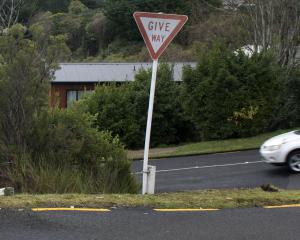 The give way sign at the intersection of Fea and Orbell Sts has been re-erected but the barrier...