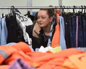 Christchurch resident Maeve Cleary hunts for bargins at a pop-up sale hosted to raise money for...