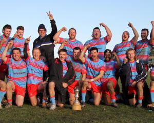 Southern Region players celebrate retaining the Topp Cup in Balclutha on Saturday. PHOTO: NICK BROOK