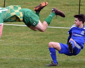 Green Island’s Jack Kelly flies over over the top of Mosgiel’s Isaac Hamilton during a Southern...