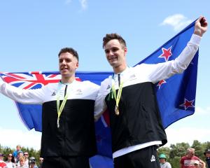 Ben Oliver (left) and Sam Gaze celebrate their 1-2 finish in the mountain biking. Photo: Getty...