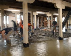 Concrete is laid in the New Zealand Loan and Mercantile building in Dunedin yesterday. PHOTO:...