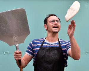 Slice of Heaven pizza caravan owner Gareth West prepares pizzas to go with borscht at his...