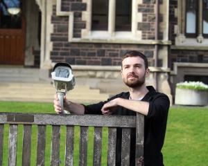 University of Otago second year masters student Thomas Stevenson shows one of the sky-facing...